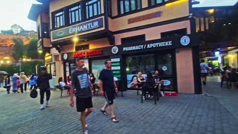 People walking down a sidewalk next to. Stock Footage 282999861