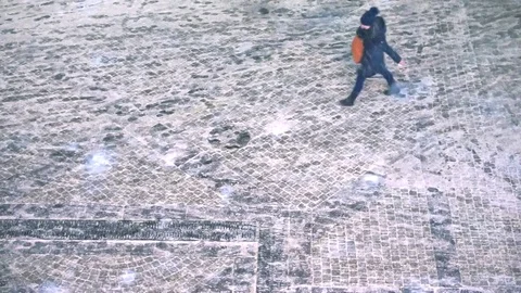 People walking down the sidewalk in the snow. the snowfall Video stock 70178608