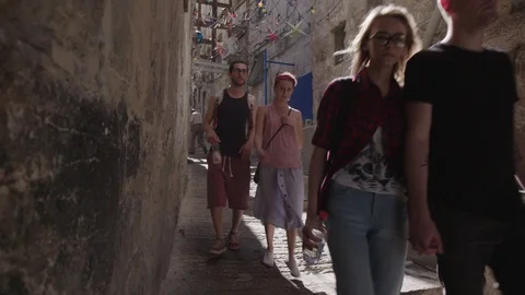 People walking down a stairs in Old City Jerusalem Stock Footage 86037229