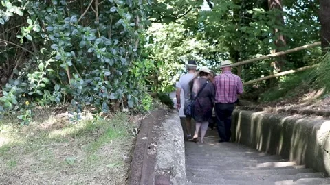 People walking down steps from nothe fort to weymouth harbour Vídeo Stock 137236345