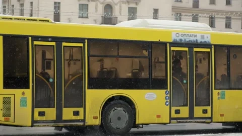People walking down the street during a snowfall, public transport Stock Footage 264893017