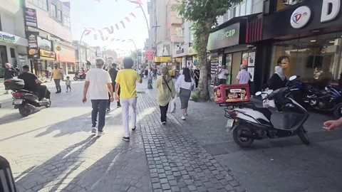 People walking down a street with a. Stock Footage 282663530