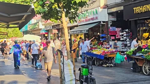 People walking down a street with a. Stock Footage 282684071
