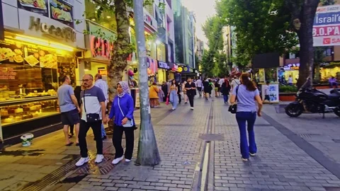 People walking down a street in a. Stock Footage 284058023