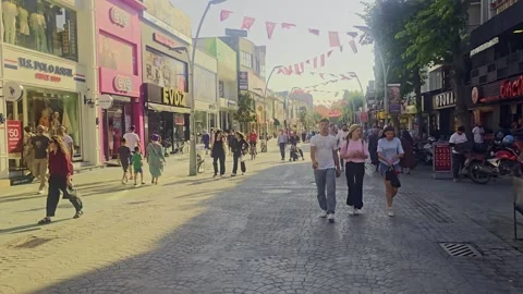 People walking down a street in a. Stock Footage 284648543