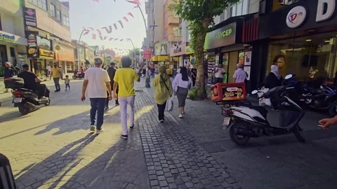 People walking down a street with a. Stock Footage 284648799
