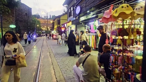 People walking down a street in a. Stock Footage 284673798