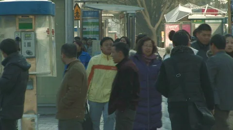 People walking in downtown Beijing, China Stock Footage
