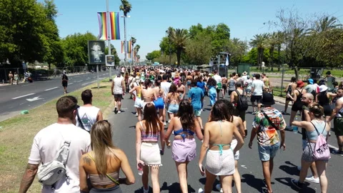 People walking during the Pride parade procession on Rokach Boulevard Stock Footage 197336917