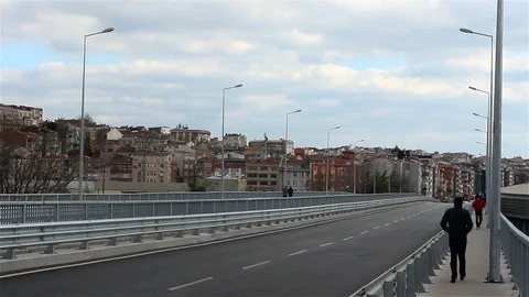 People walking on an empty bridge Stock Footage 106128016