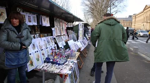 People walking at the famous galleries boxes along the Seine River in Paris Stock Footage 46779953