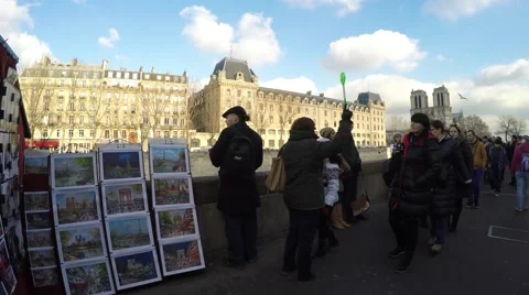 People walking at the famous galleries boxes along the Seine River in Paris 스톡 동영상 46807470