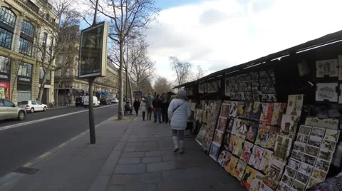 People walking at the famous galleries boxes along the Seine River in Paris Stock Footage 47368316