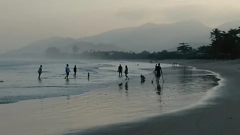 People walking into forest along a river in coast city of Ubatuba, southeast Bra Stock Footage 201973049
