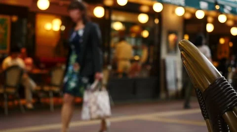 People walking in front of cafe in slow motion Stock Footage 63634601