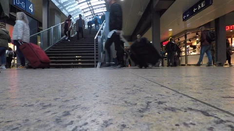 People walking in front of camera at a Cologne train station Stock Footage 295432224