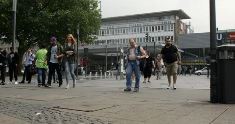 People walking in front of the central railway station of Essen city, Germany 4K Stock Footage 90477543