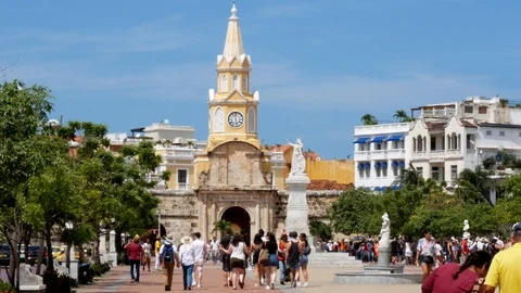 People walking in front of the clock tower gate in Cartagena, Colombia Stock Footage