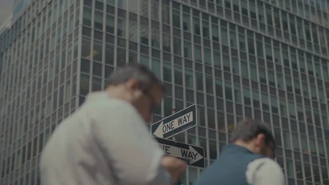 People walking in front of one way sign in New york Stock Footage 120528548