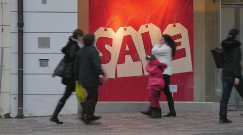 People walking in front of a shop window with a big sale sign, timelapse Video stock 45826528