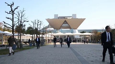 People walking in front of traingle structure building, Japan Stock Footage 95311400