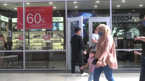 People walking in front of a watch store Video stock 236394627