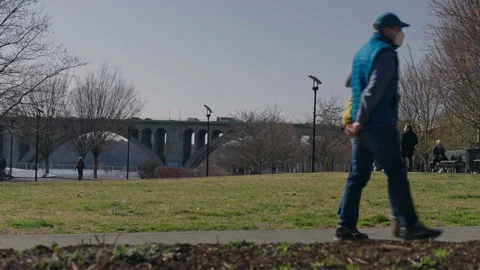 People Walking in Georgetown Waterfront Park Stock Footage 155755566