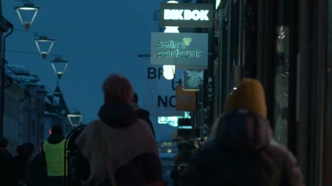 People walking on Götgatan Stockholm cinematic winter vintage lens Stock Footage