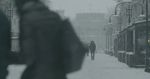 People walking in heavy snowfall in Sofia center in slow motion 스톡 동영상 87608597