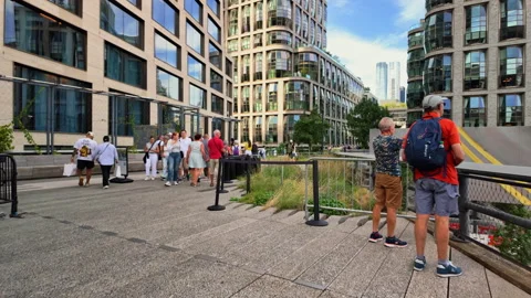People walking on the High Line elevated park path in Chelsea Manhattan New York Stock Footage 327763805