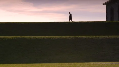 People Walking on Hill at Sunset, Dramatic Lighting on Hills Stock Footage 127256899