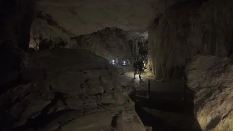 People walking inside cave at ha long bay Stock Footage 287211837