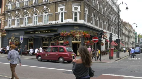 People walking by the Jack Horner Pub in London Stock Footage 60818641