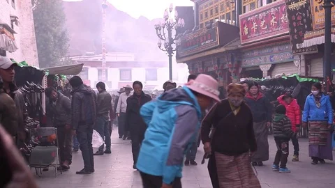 People walking in Lhasa, India Stock Footage 78022556