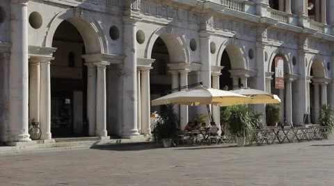 People walking in Lords Square close to Basilica Palladiana in historical center Stock Footage