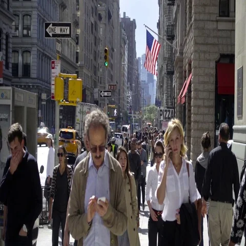 People walking man checking cell phone on crowded busy Midtown Manhattan NYC 動画素材 69380608