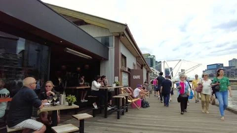 People Walking at Melbourne DFO Oulets Stock Footage 221213094