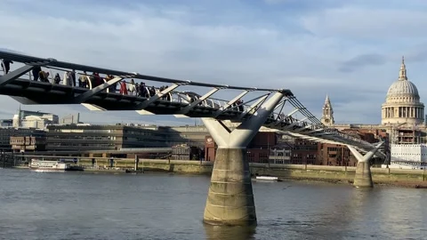 People walking on Millennium bridge at sunset in London Stock Footage 170191744
