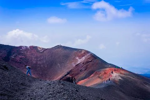 People walking on Mount Etna, active volcano on the east coast of Sicily Stock Photos