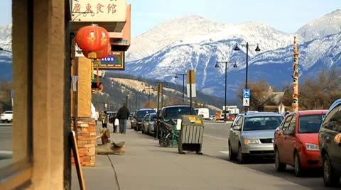 People walking in mountain town Stock Footage 10749583