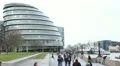 People walking near City Hall, Greater London Authority, Mayor, Thames River HD Footage