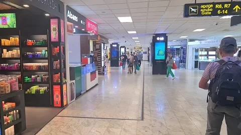 People walking near duty free shops in Stock Video Pond5
