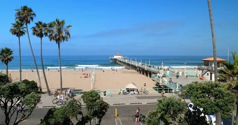 People walking near Manhattan beach pier in Los Angeles, California, 4K Stock Footage