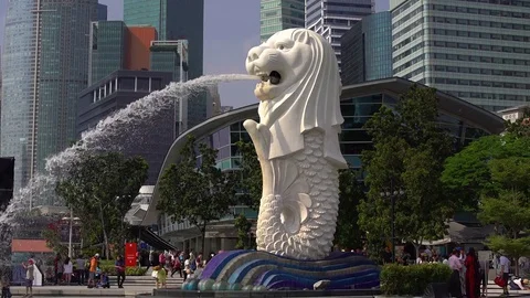 People walking near Singapore Lion statue Stock Footage