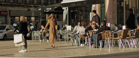 People walking next to a cafe Stock Footage 151402993