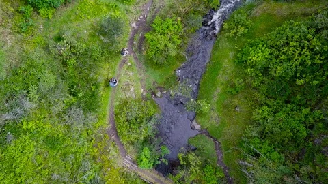 People Walking Next To Small River [Drone Footage] Stock Footage 88346635
