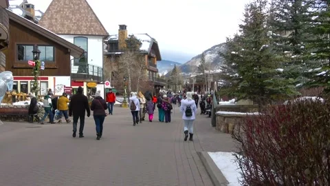People walking next to stores in small mountain town. Stock Footage 131321555