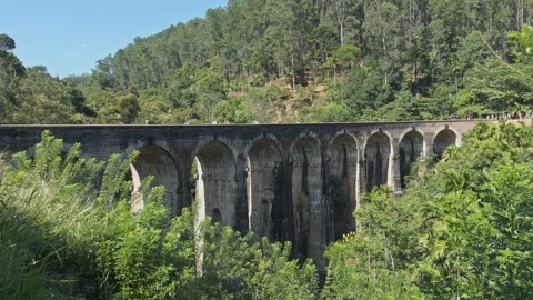 People walking on nine arch bridge in sri lanka Stock Footage 322805590