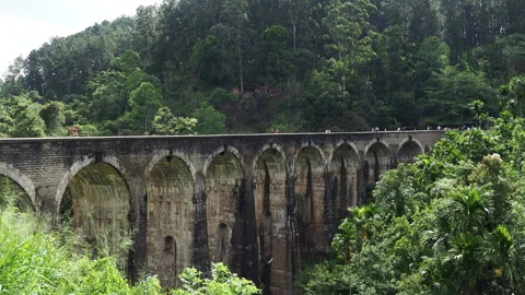 People walking on nine arch bridge in ella, sri lanka Stock Footage 340642978