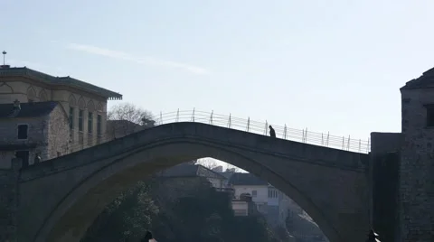 People walking on old bridge Mostar Видео 47010452